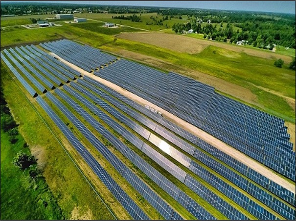 Solar farm with thousands of solar panels producing large amounts of solar power