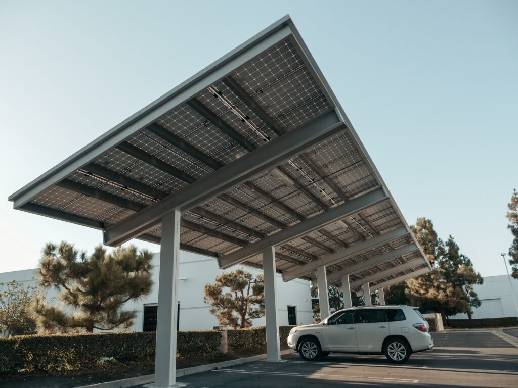 Solar panels installed over cars in a dealership parking lot